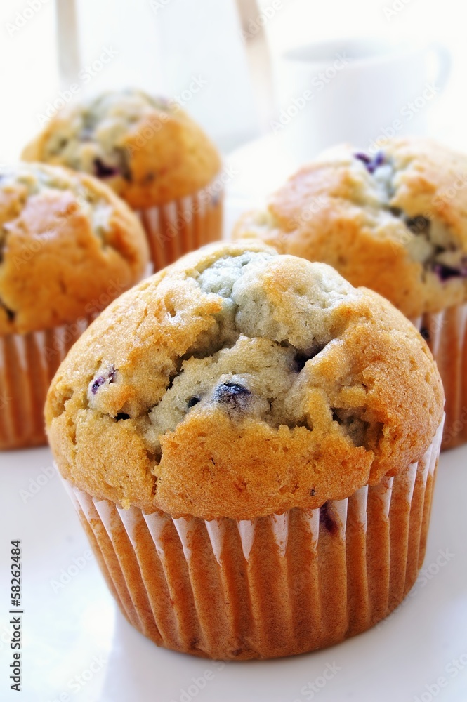 Blueberry muffins with coffee cup and maker Blueberry muffins with coffee cup and maker