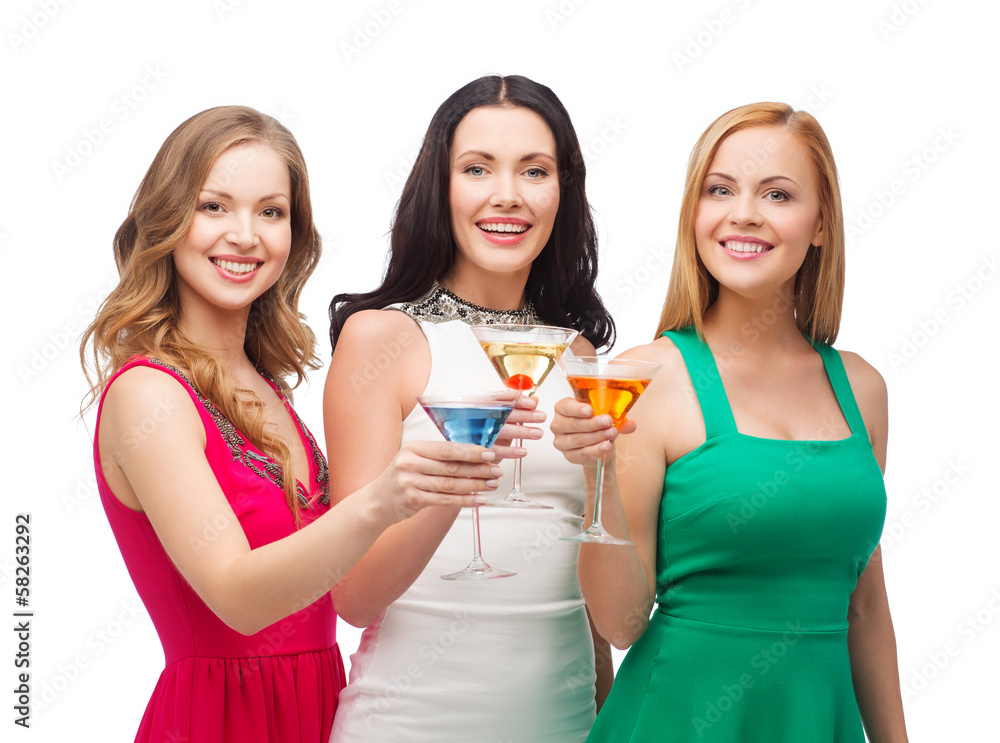 three smiling women with cocktails three smiling women with cocktails