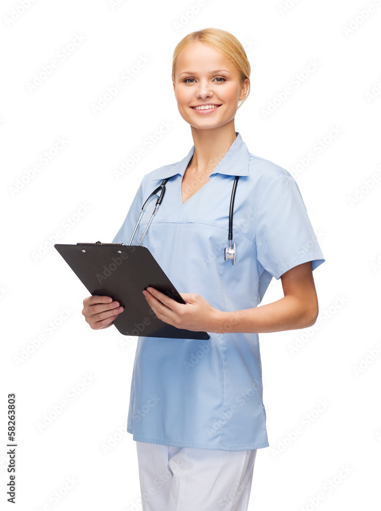 smiling female doctor or nurse with clipboard smiling female doctor or nurse with clipboard