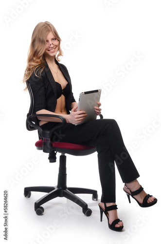 Businesswoman in an armchair isolated on white background © Vladimir Voronin
