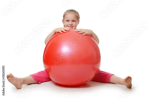 Little girl with a gymnastic ball