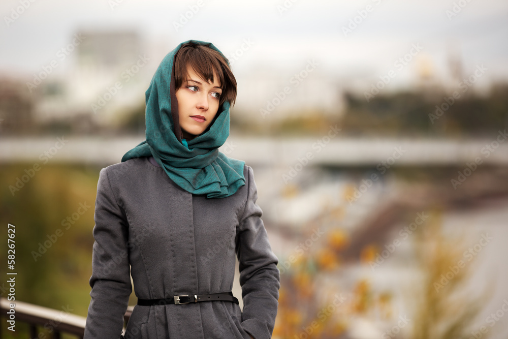 Sad young woman in grey classic coat Sad young woman in grey classic coat