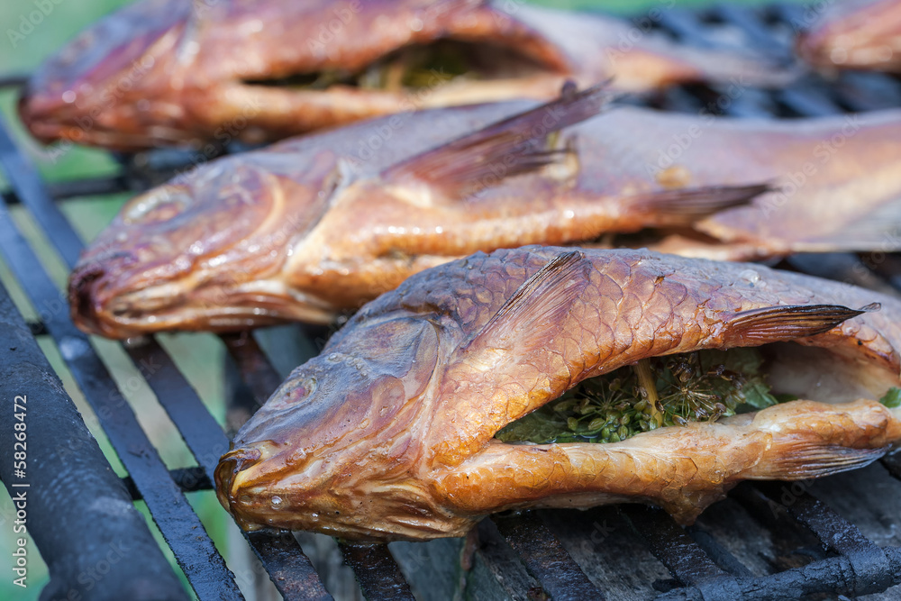 Beautiful freshly cooked smoked fish at the outdoor Beautiful freshly cooked smoked fish at the outdoor