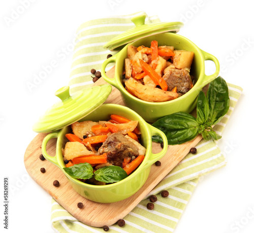 Homemade beef stir fry with vegetables in color pans, isolated
