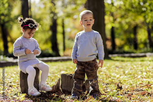 Litle boy and girl at the a...