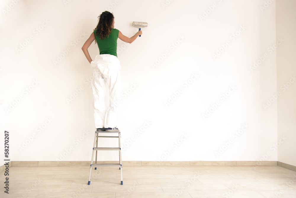 Painter girl standing on a small bench Painter girl standing on a small bench