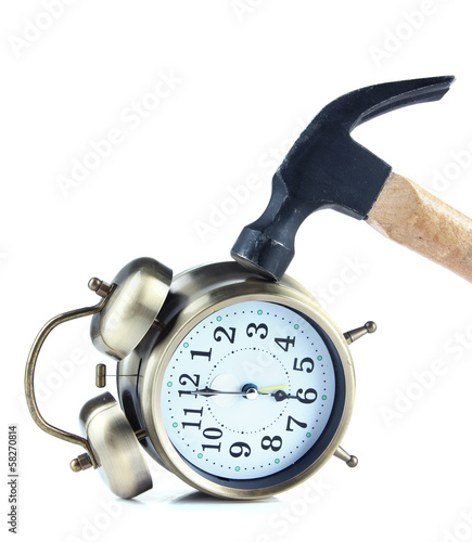 Hammer on alarm clock isolated on white