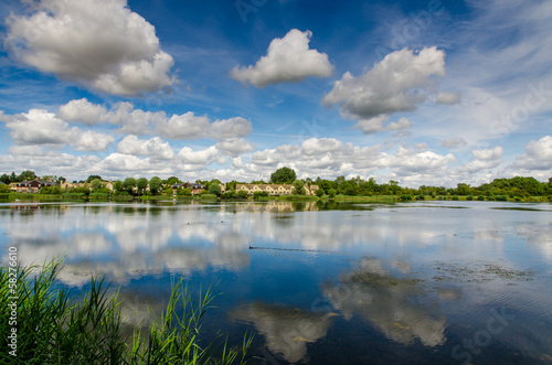 Amazing lake vista with blue sky and clouds