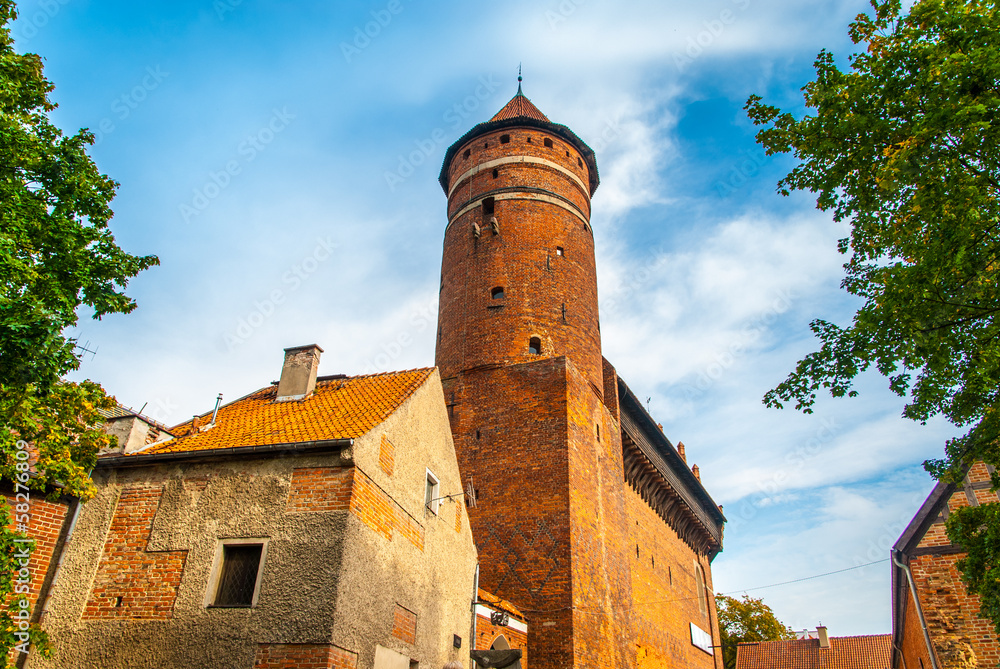 Castle tower against blue sky