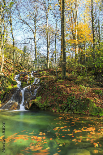 Beautiful waterfalls on a sunny autumn day in the mountains