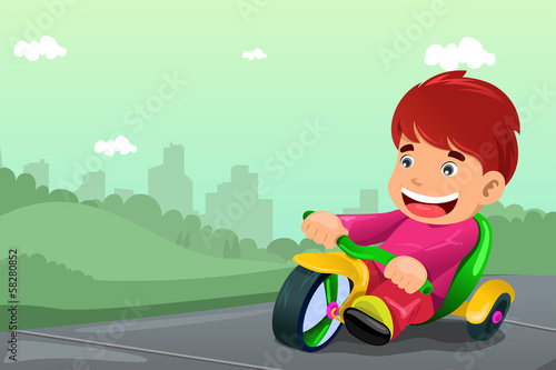 Boy riding tricycle