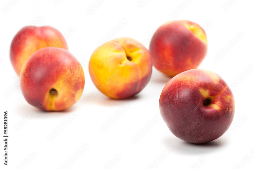 Ripe peaches fruits isolated on white