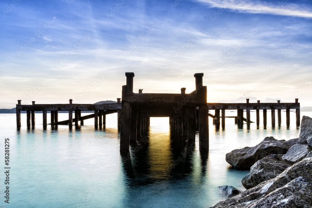Calm scene detail of old jetty at twilight Calm scene detail of old jetty at twilight
