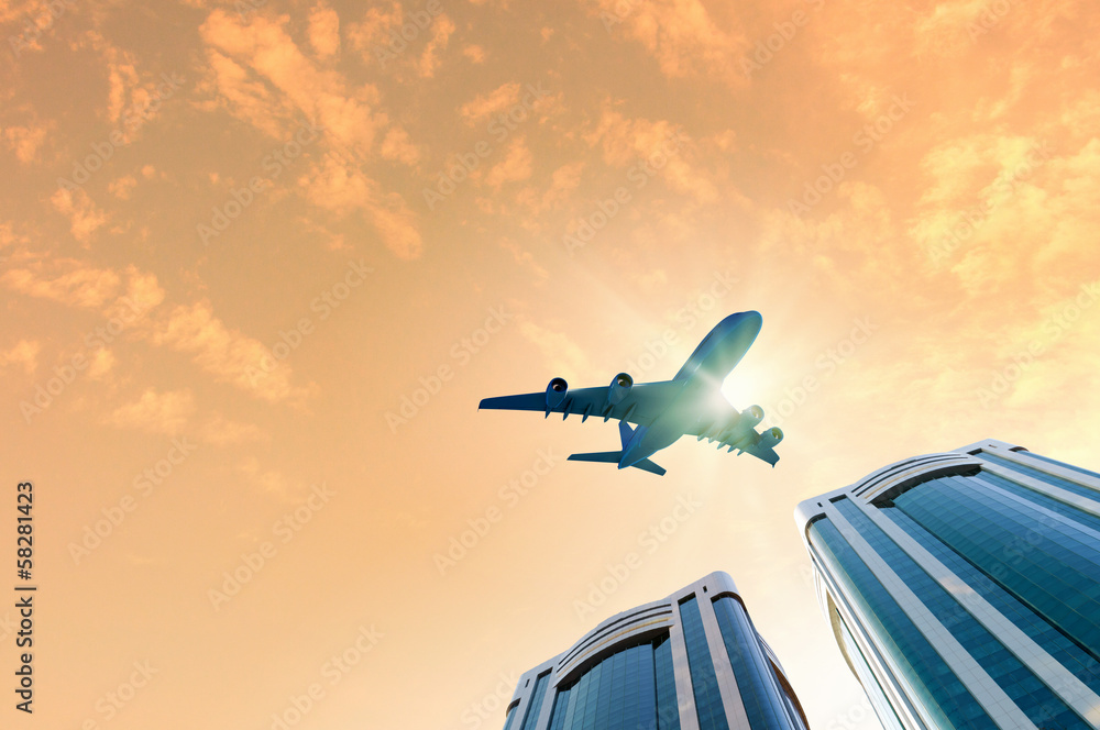 Fototapeta premium Airplane above city
