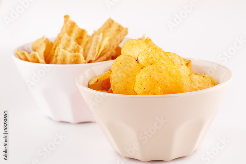 Potato and wheat chips in bowls