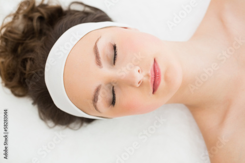 Brunette with eyes closed in beauty salon