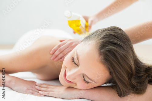 Close up of beautiful woman enjoying oil massage