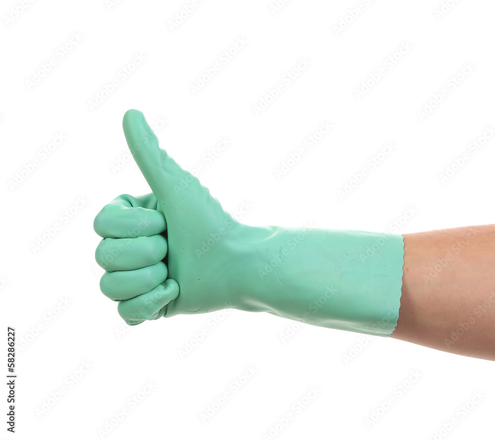 Hand shows thumb up in rubber glove. Hand shows thumb up in rubber glove.