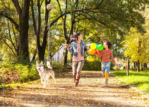 Happy family walking in park