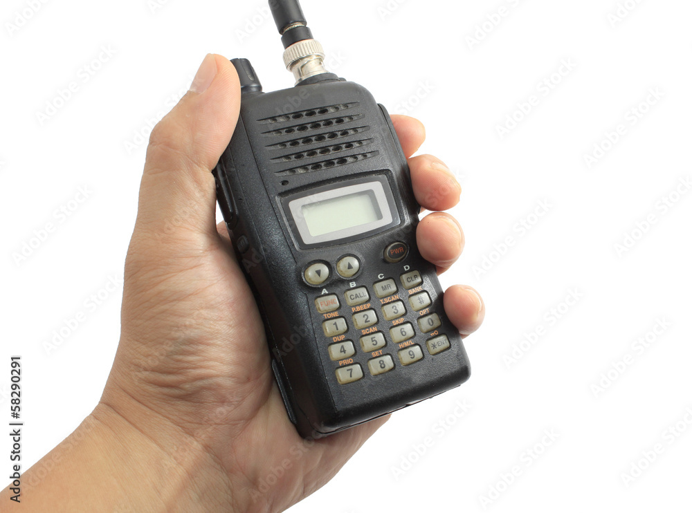 Hand holding black ham radio isolated on white Hand holding black ham radio isolated on white