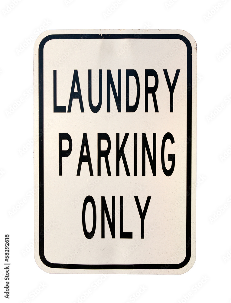 An old laundry parking only sign on a white background