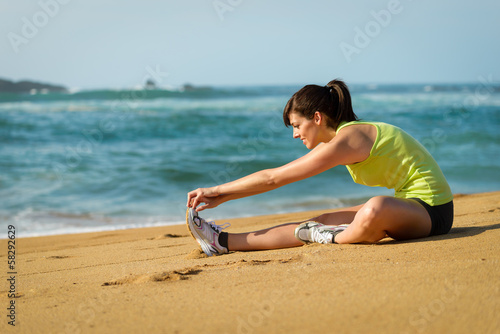 Woman waming up stretching leg