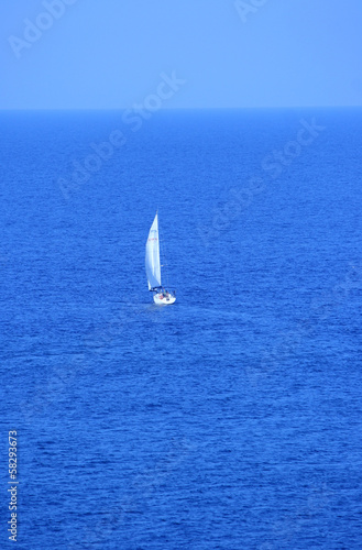 sailing boat heading to the sea
