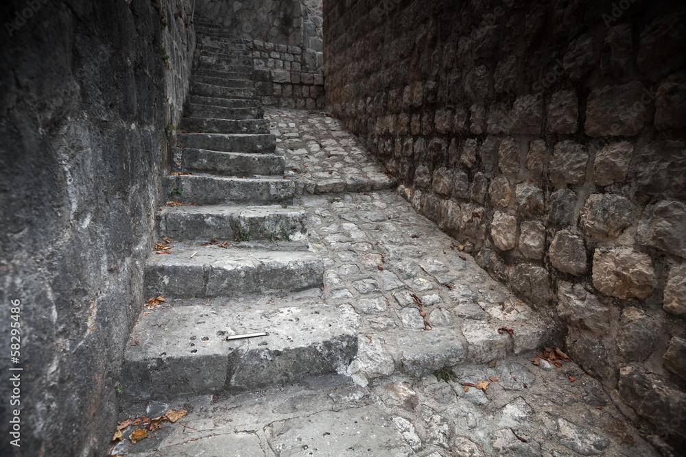 Old stone stairway goes up on the street of Perast town, Montene Old stone stairway goes up on the street of Perast town, Montene