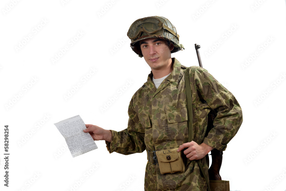 young American soldier  shows a photograph