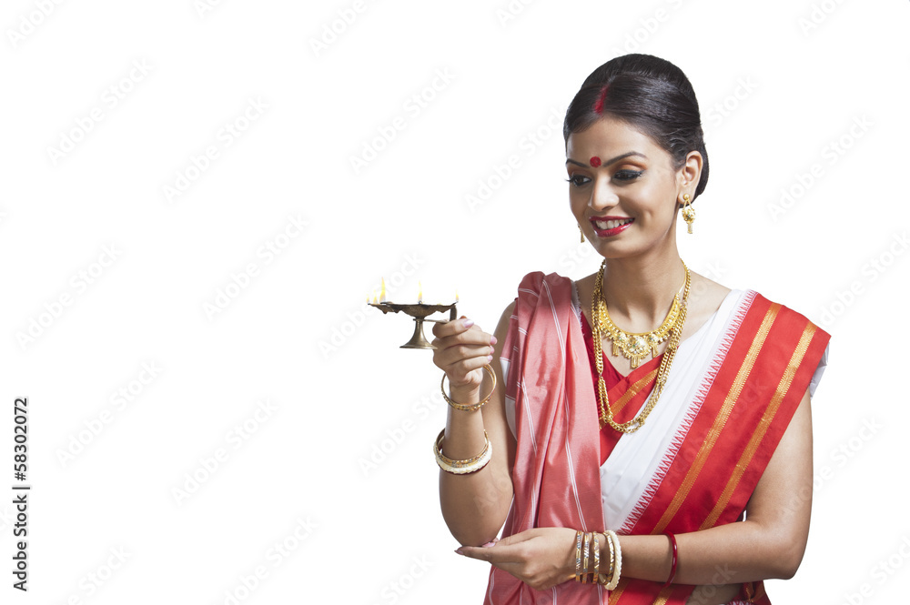 Traditional Bengali woman holding oil lamp Stock Photo Adobe Stock