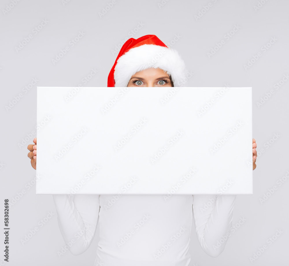 woman in santa helper hat with blank white board woman in santa helper hat with blank white board