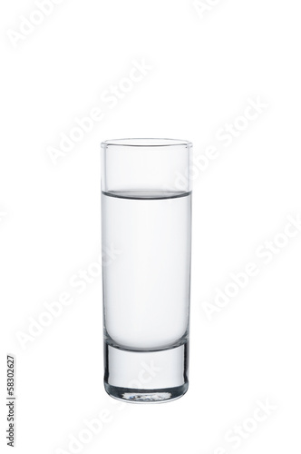 A full elegant vodka glass on white background