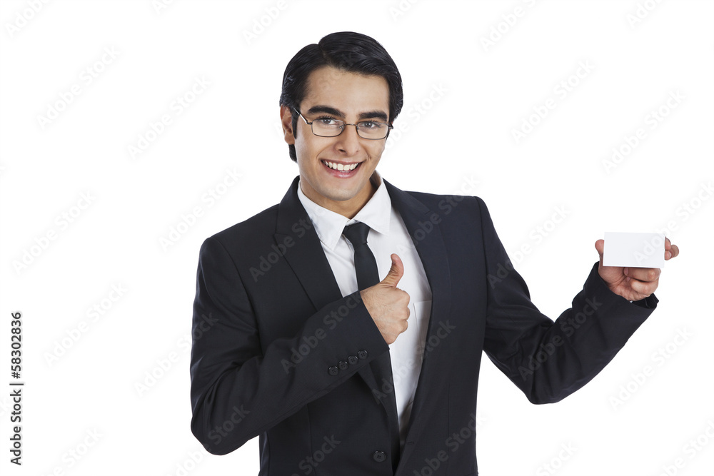 Portrait of a businessman showing a blank business card Portrait of a businessman showing a blank business card