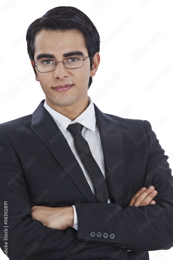 Portrait of a businessman smiling with his arms crossed Portrait of a businessman smiling with his arms crossed
