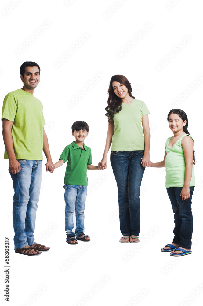 Portrait of a happy family holding hands