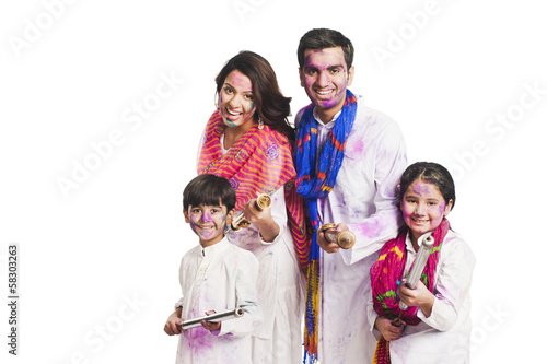 Family celebrating Holi festival