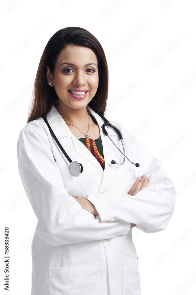 Female doctor standing with her arms crossed and smiling Female doctor standing with her arms crossed and smiling