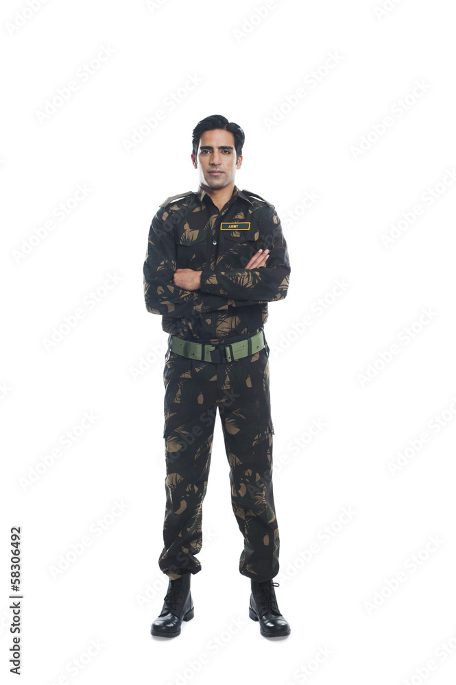 Portrait of an army soldier standing with his arms crossed Portrait of an army soldier standing with his arms crossed