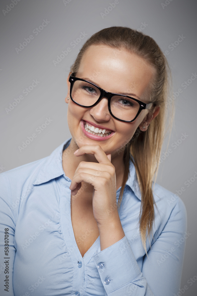 Portrait of beautiful smiling businesswoman with glasses