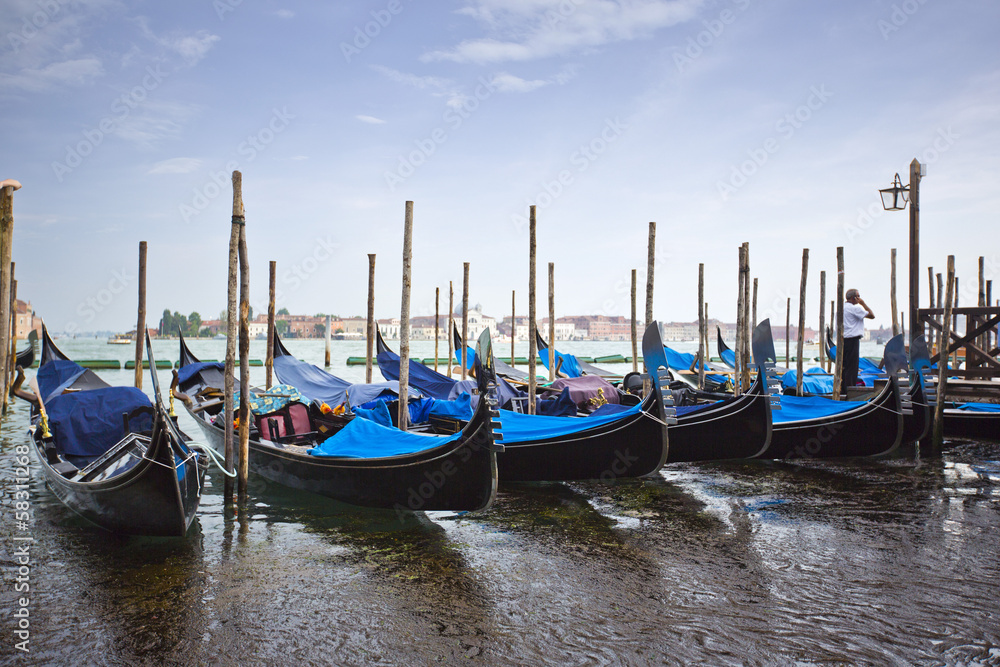 Gondolas moored at dock, Venice, Veneto, Italy