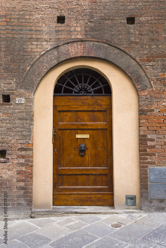 Closed door of a building, Siena, Siena Province, Tuscany, Italy