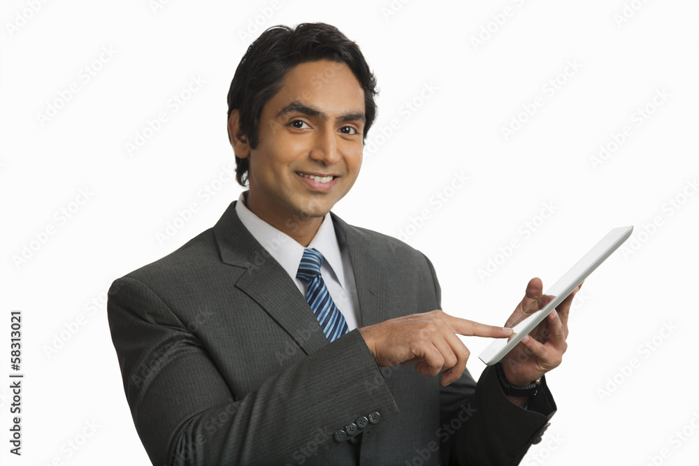 Portrait of a smiling businessman holding a digital tablet Portrait of a smiling businessman holding a digital tablet