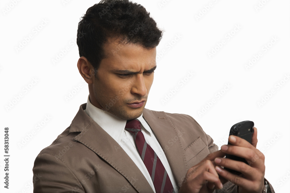Naklejka premium Businessman using a mobile phone