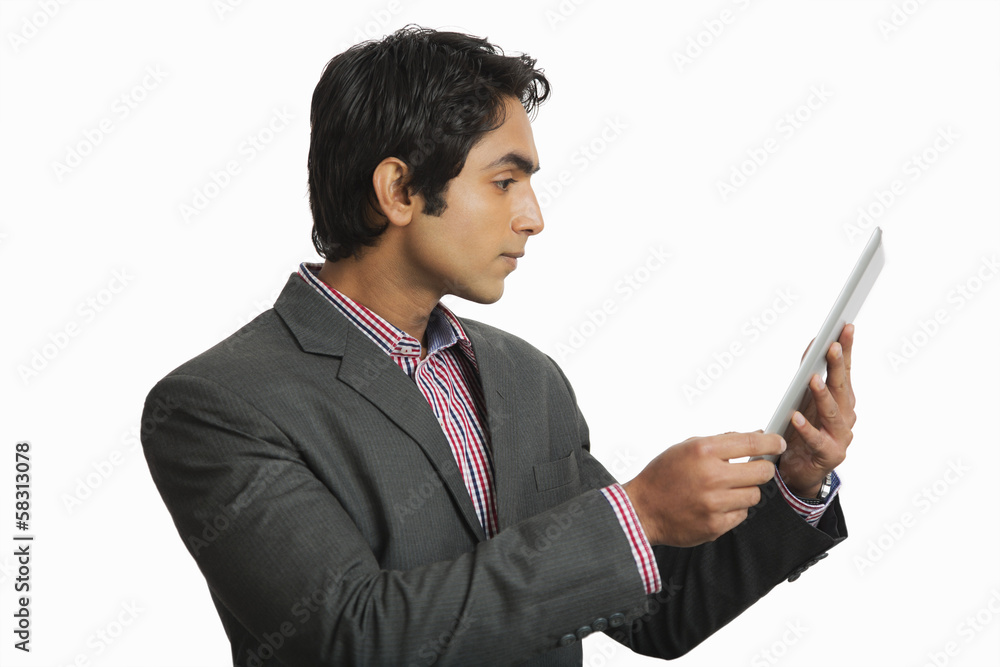 Businessman looking at a digital tablet Businessman looking at a digital tablet