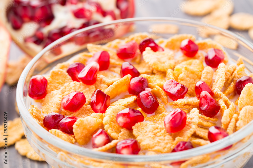 Sugar coated corn flakes with milk and pomegranate Sugar coated corn flakes with milk and pomegranate