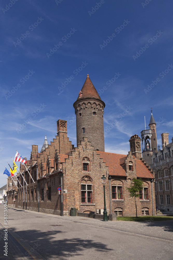 Tower and old houses in Bruges