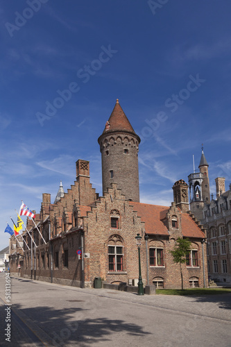 Tower and old houses in Bruges