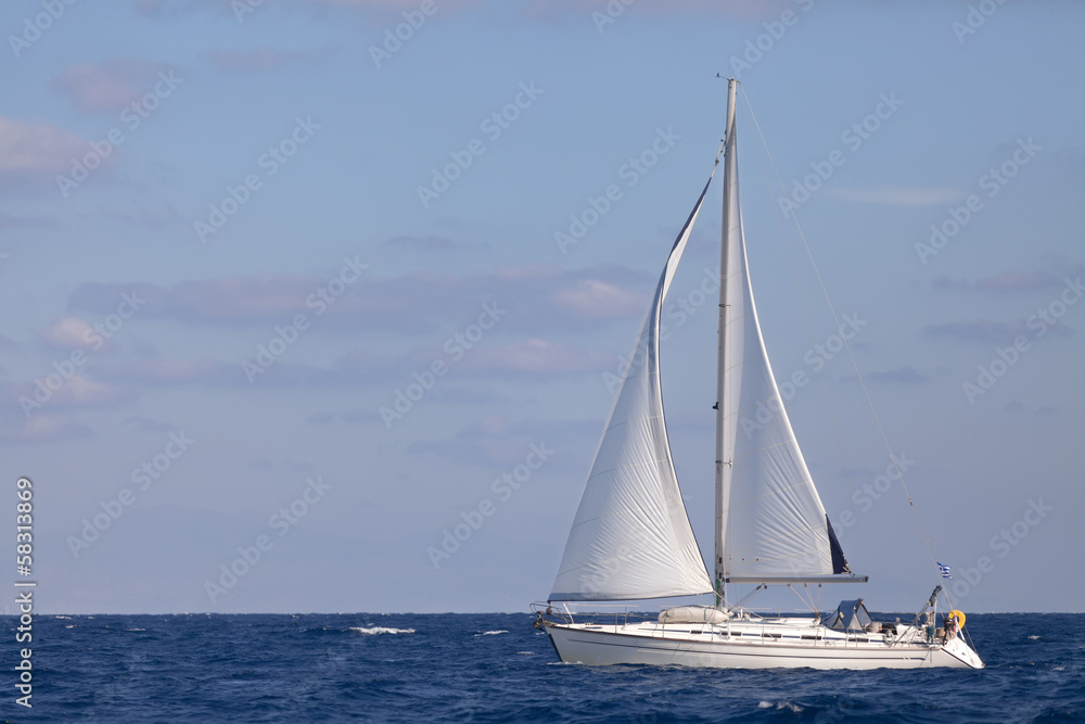 Sailing boat in  blue sea