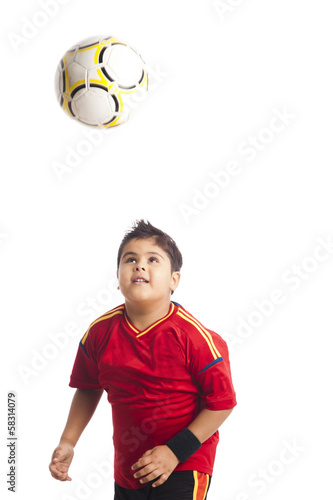 Boy playing with a soccer ball