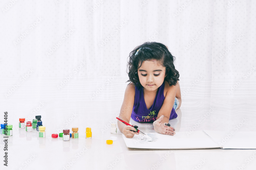 Girl painting with water colors